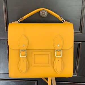 Yellow Cambridge Satchel Company back pack style purse